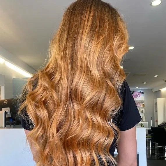 Mid-Back Golden Blonde Balayage With Wavy Blowout — Trendy Golden Blonde