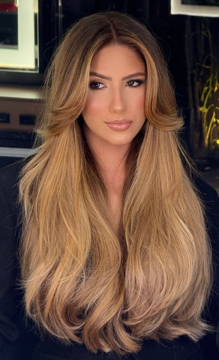 Mid-Back Golden Blonde With Curtain Bangs and Long Layers — Trendy Golden Blonde