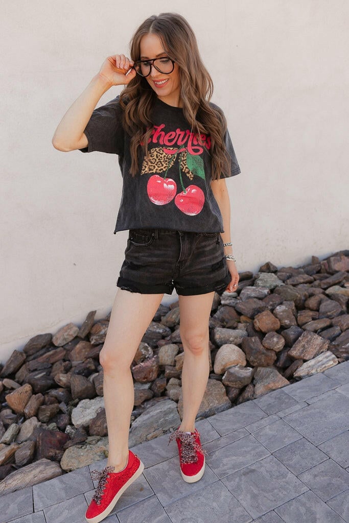 Cropped Graphic Tee With Distressed Shorts and Red Glitter Sneakers — Trendy Graphic Tee Outfits