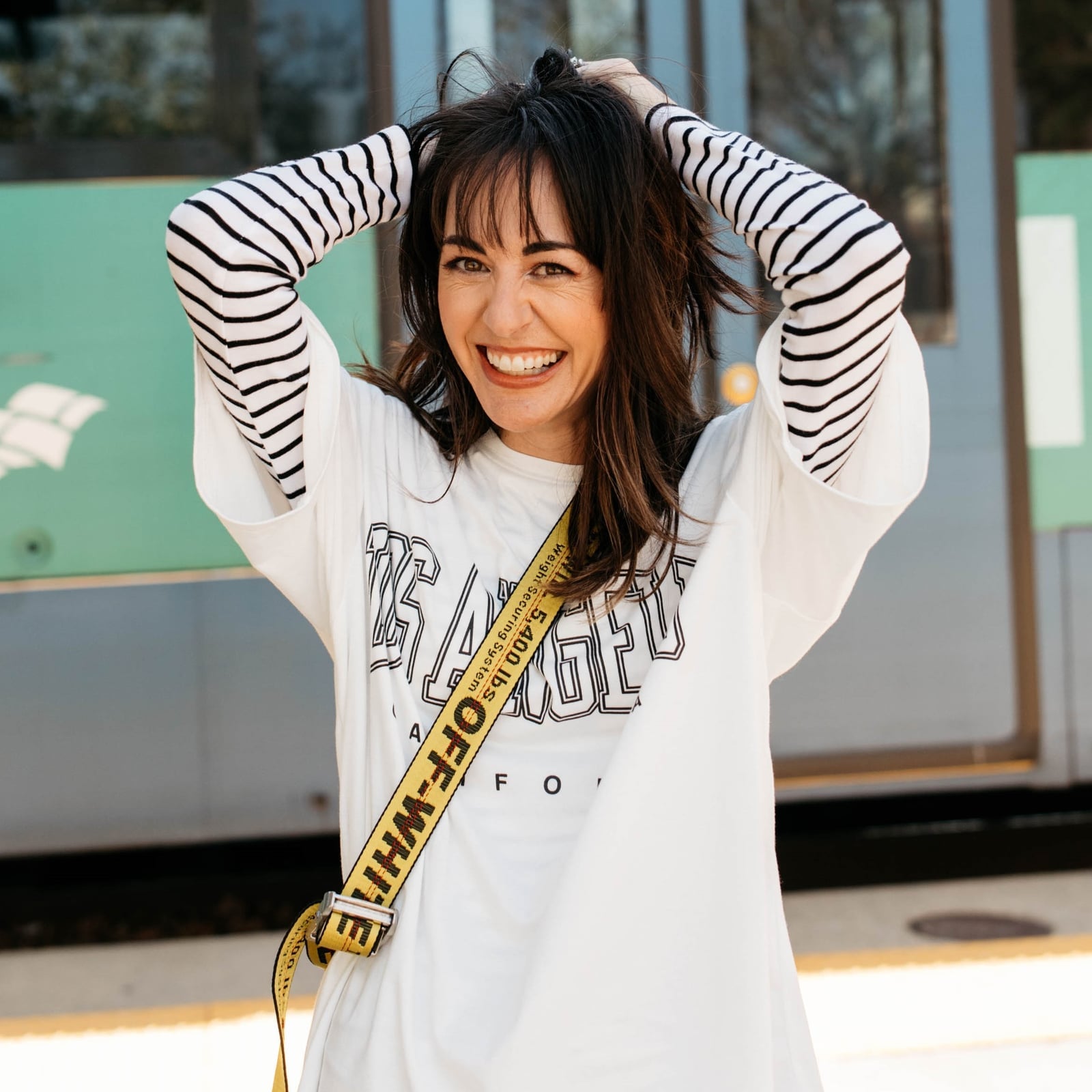 Layered Graphic Tee Over Striped Shirt — Trendy Graphic Tee Outfits