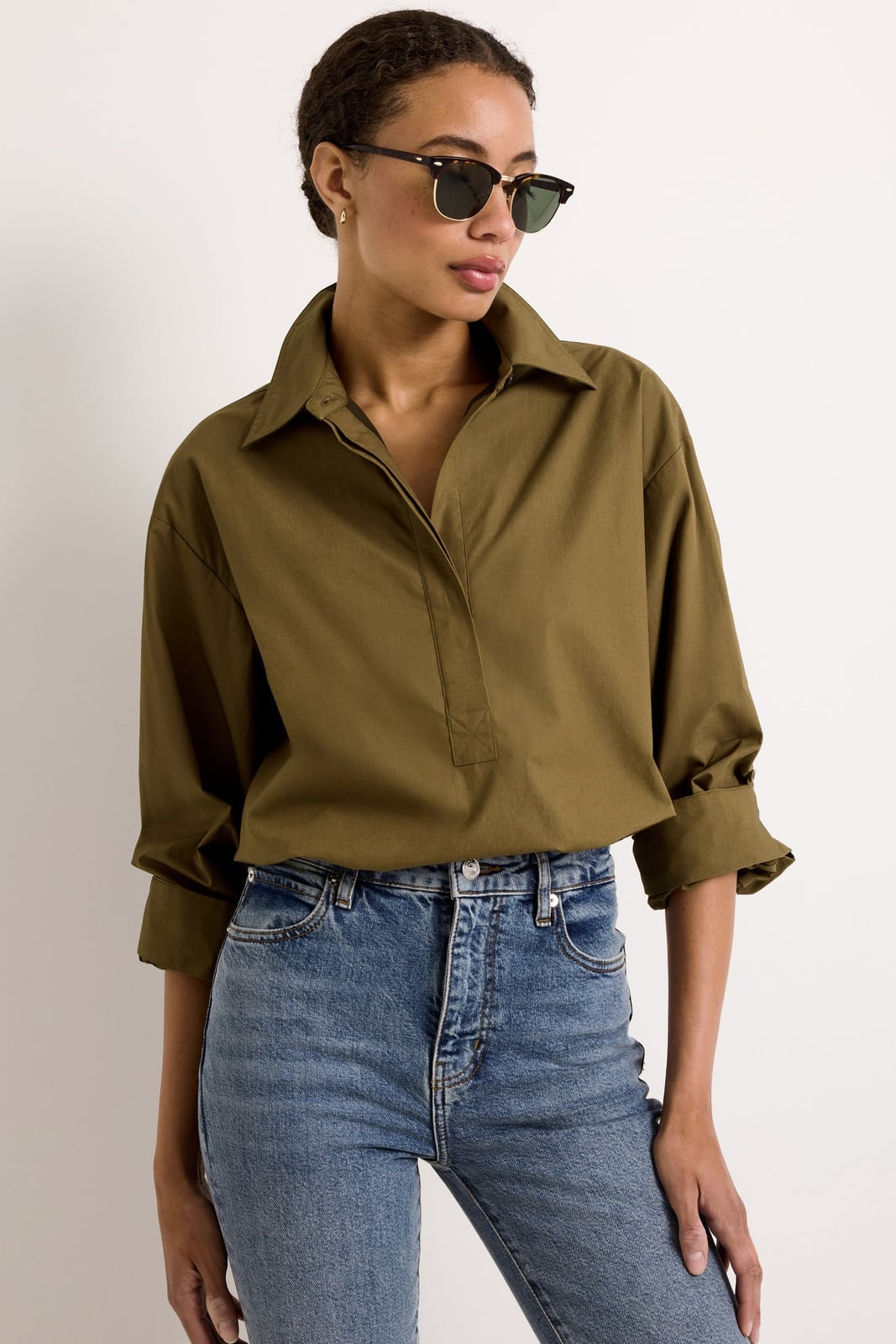 Oversized Olive Green Collared Blouse with Blue Jeans, Close-Up Take Oversized Olive Green Collared Blouse with Blue Jeans, Close-Up Take — Trendy Green Top Outfits