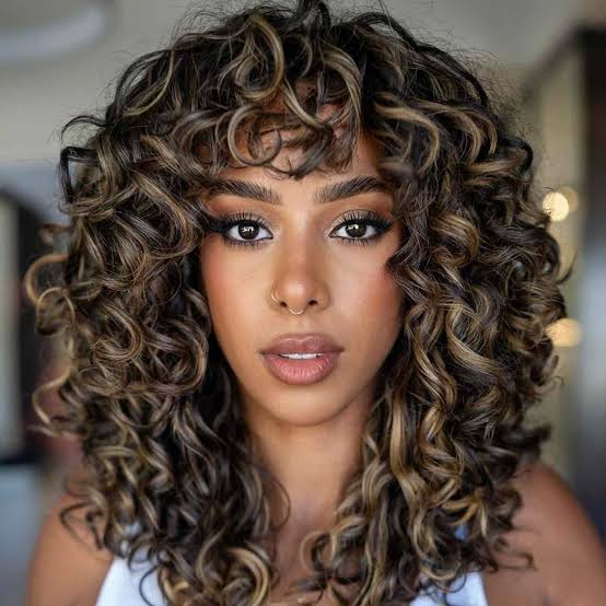 Thick Curly Collarbone Shag With Defined Bangs — Trendy Hairstyles for Teens