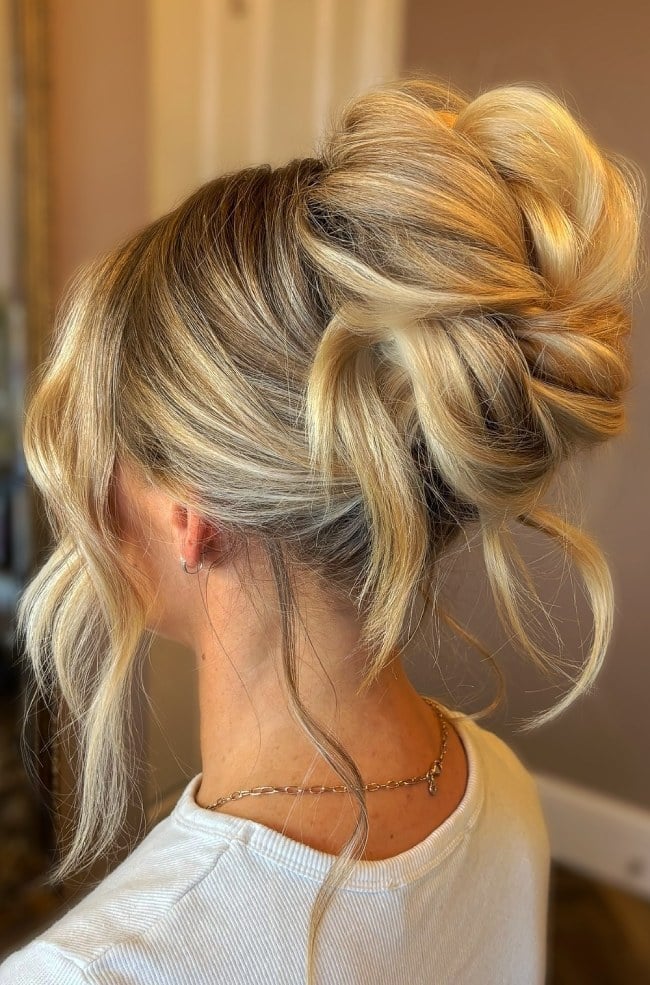 Messy Twisted High Bun Dark Brown Subtle Highlights With Soft Tendrils Messy Twisted High Bun Dark Brown Subtle Highlights With Soft Tendrils — Trendy High Bun Hairstyles