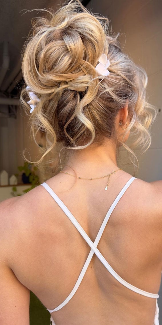 Textured High Bun Blonde With Flowers Textured High Bun Blonde With Flowers — Trendy High Bun Hairstyles