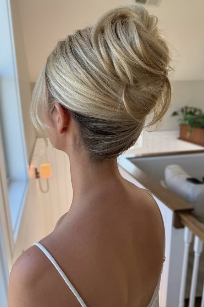 Loose Twisted High Bun Wavy Thick Blonde Hair Loose Twisted High Bun Wavy Thick Blonde Hair — Trendy High Bun Hairstyles