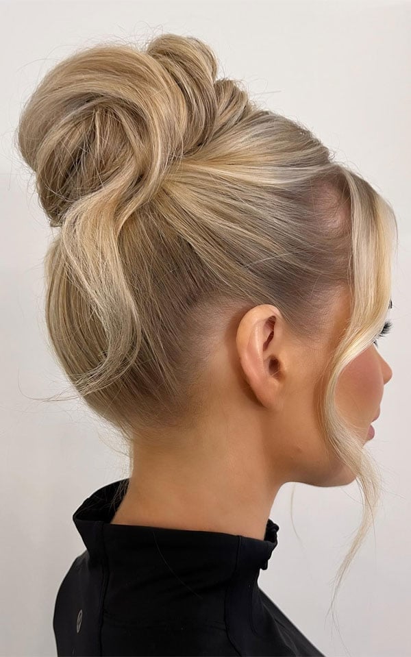 Voluminous Textured High Bun Ash Blonde Darker Roots Voluminous Textured High Bun Ash Blonde Darker Roots — Trendy High Bun Hairstyles