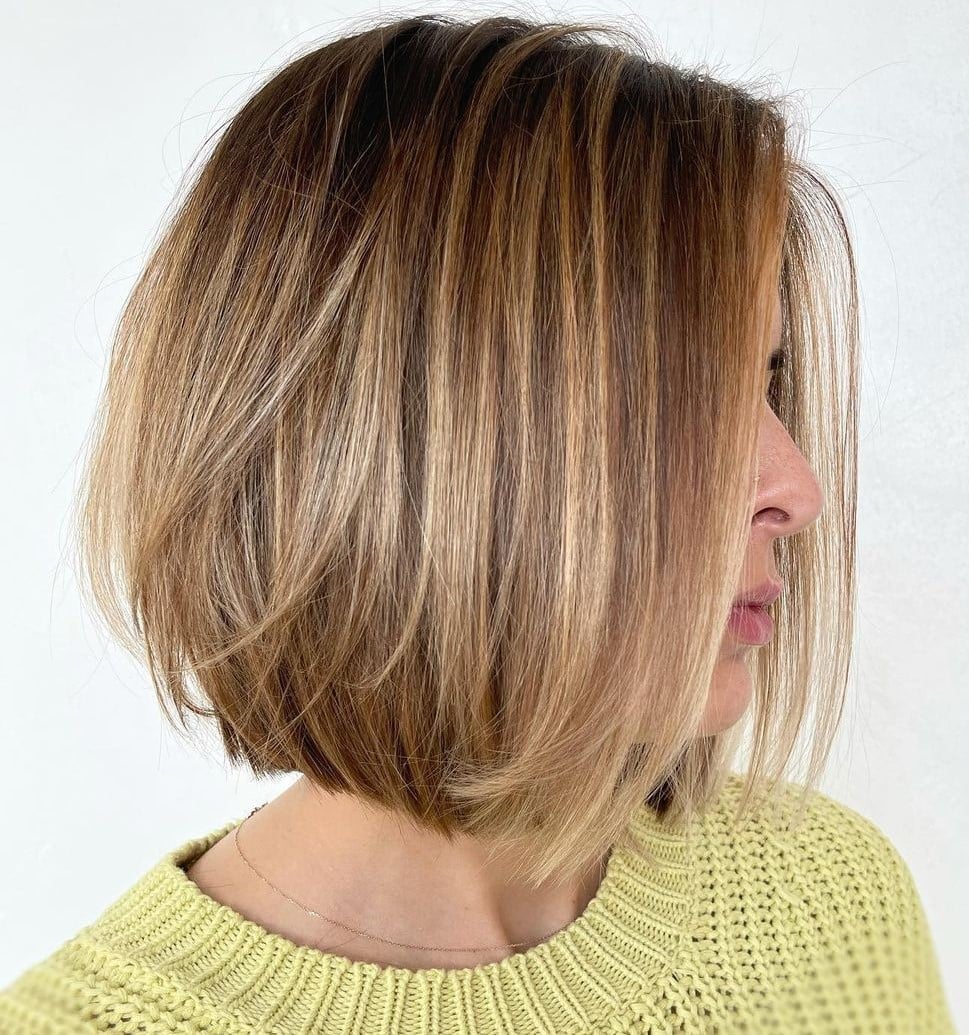 Chin-Length Bob With Blonde Highlights and Side Part — Trendy Highlights Hair