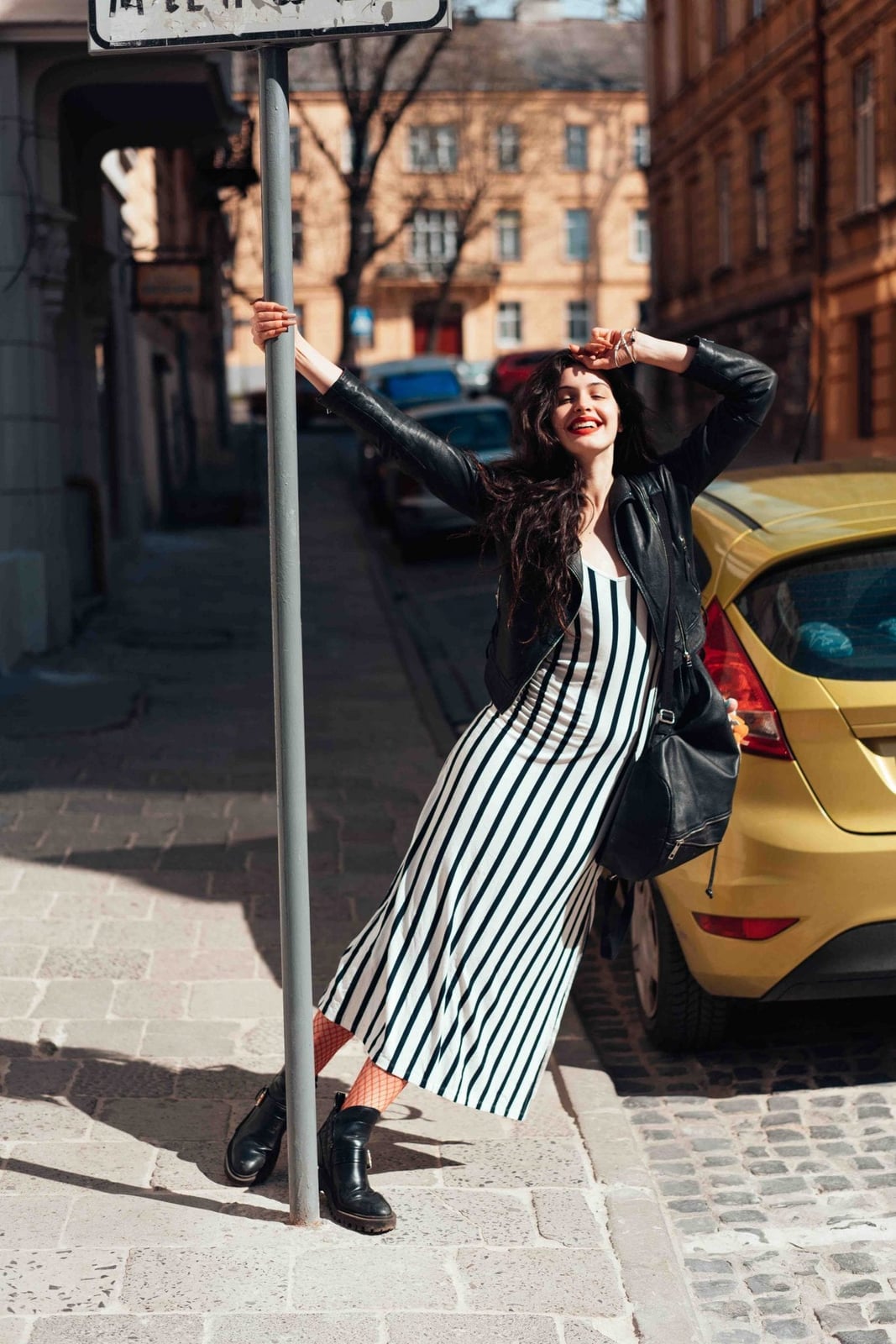 Black Leather Jacket Over Striped Maxi Dress Black Leather Jacket Over Striped Maxi Dress — Trendy Italy Outfits