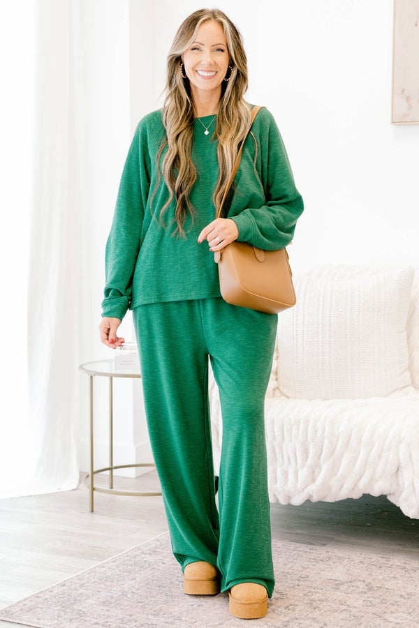 Dark Green Knit Set with Platform Clogs and A Woman Models A Relaxed Dark Green Knit Set with Platform Clogs and A Woman Models A Relaxed — Trendy Lazy Outfits