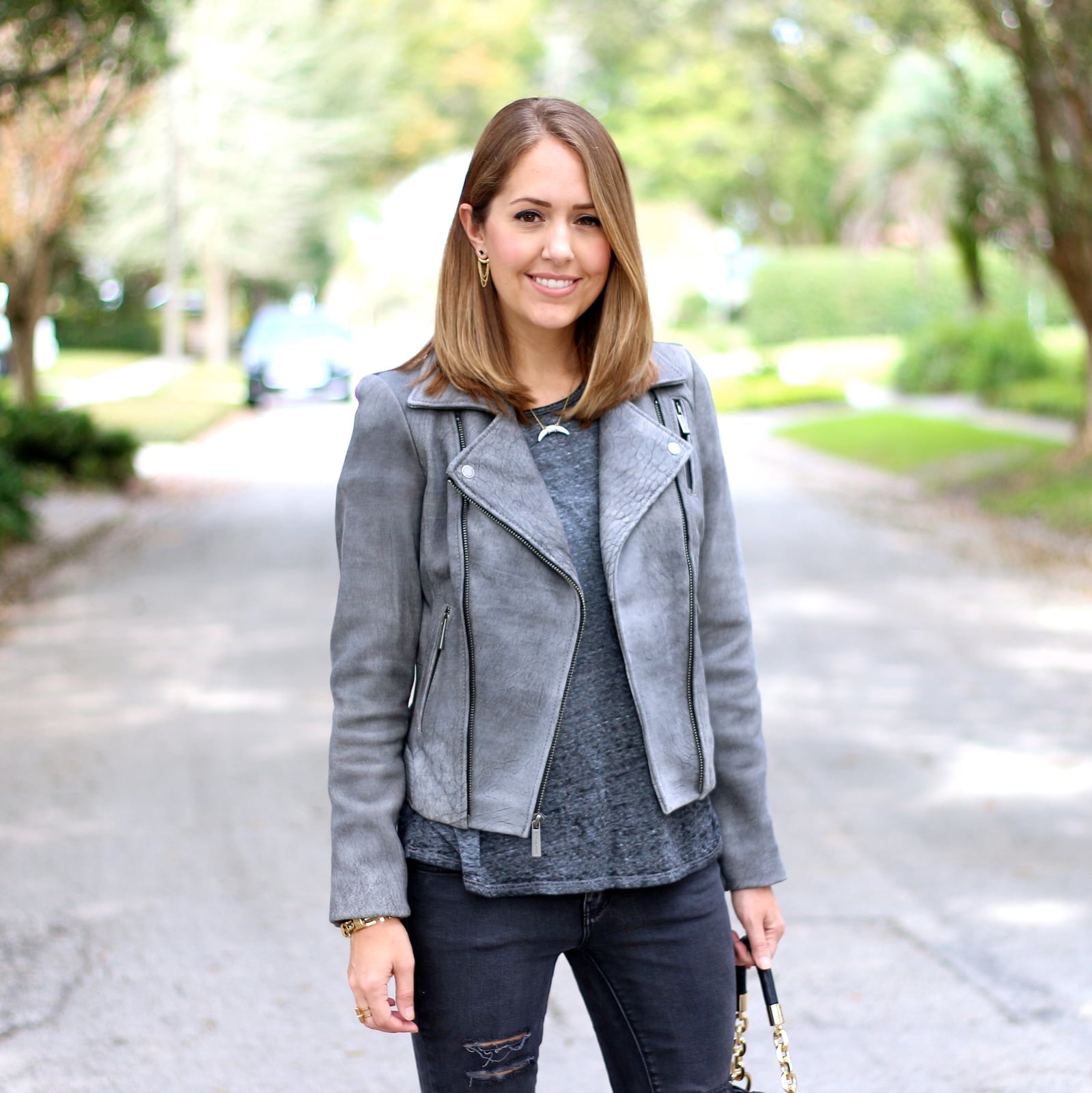 Gray Leather Moto Jacket with T-Shirt and Distressed, Close-Up Take Gray Leather Moto Jacket with T-Shirt and Distressed, Close-Up Take — Trendy Leather Jacket Outfits Women