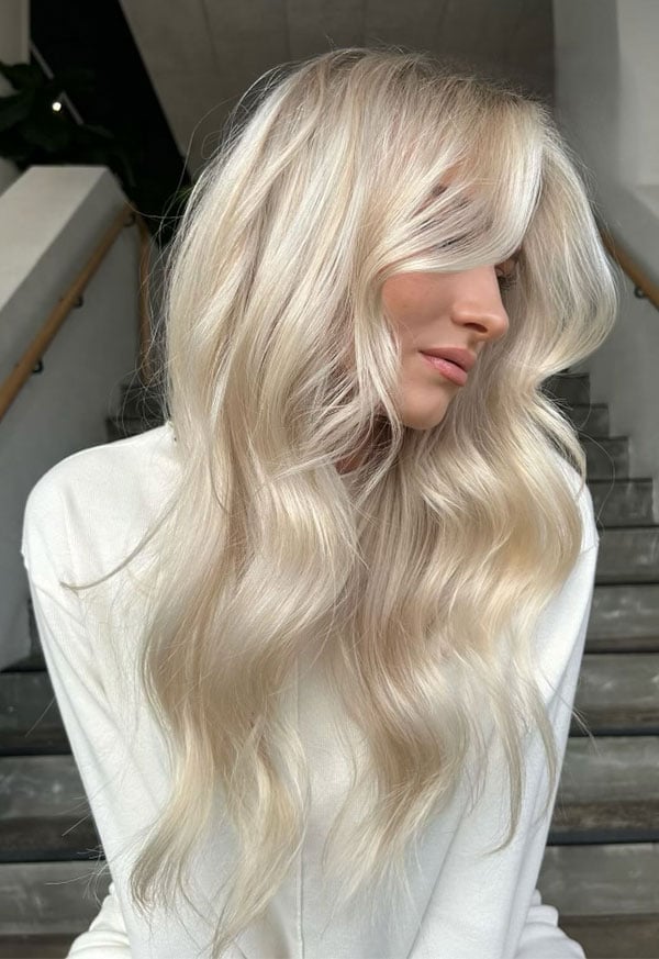 Mid-Back Pearl Blonde With Side Swept Bangs — Trendy Light Hair Color