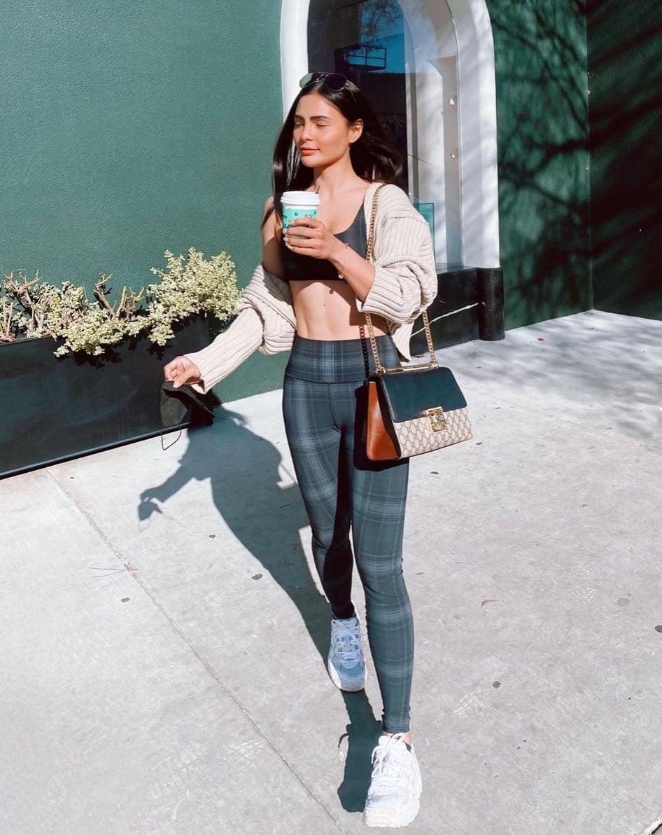 Black Leather Jacket Over Crop Top With Red Baseball Cap Black Leather Jacket Over Crop Top With Red Baseball Cap — Trendy Los Angeles Outfits