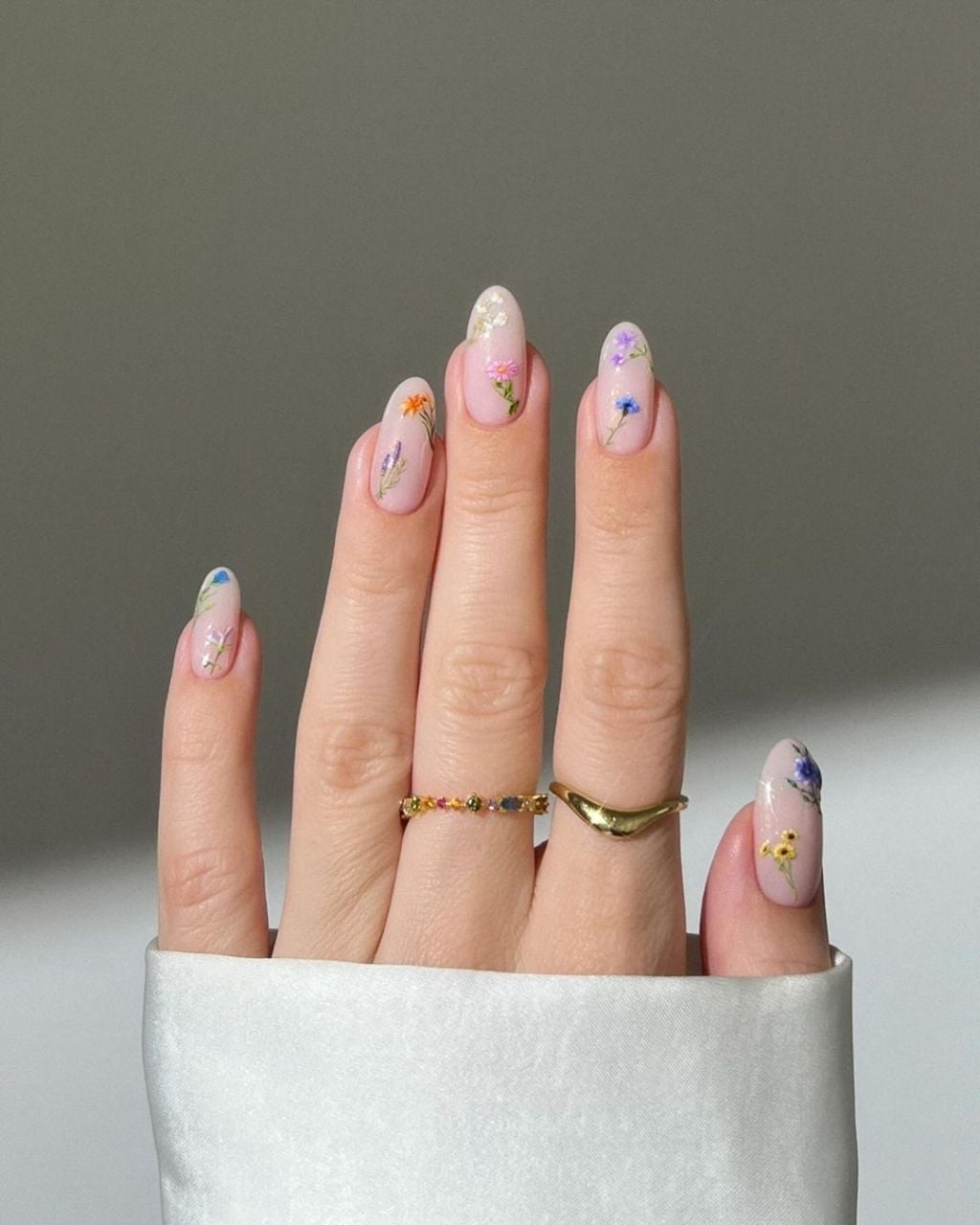 Sheer Pink Glossy Almond Nails With Floral Motifs Sheer Pink Glossy Almond Nails With Floral Motifs — Trendy Manicure Nails