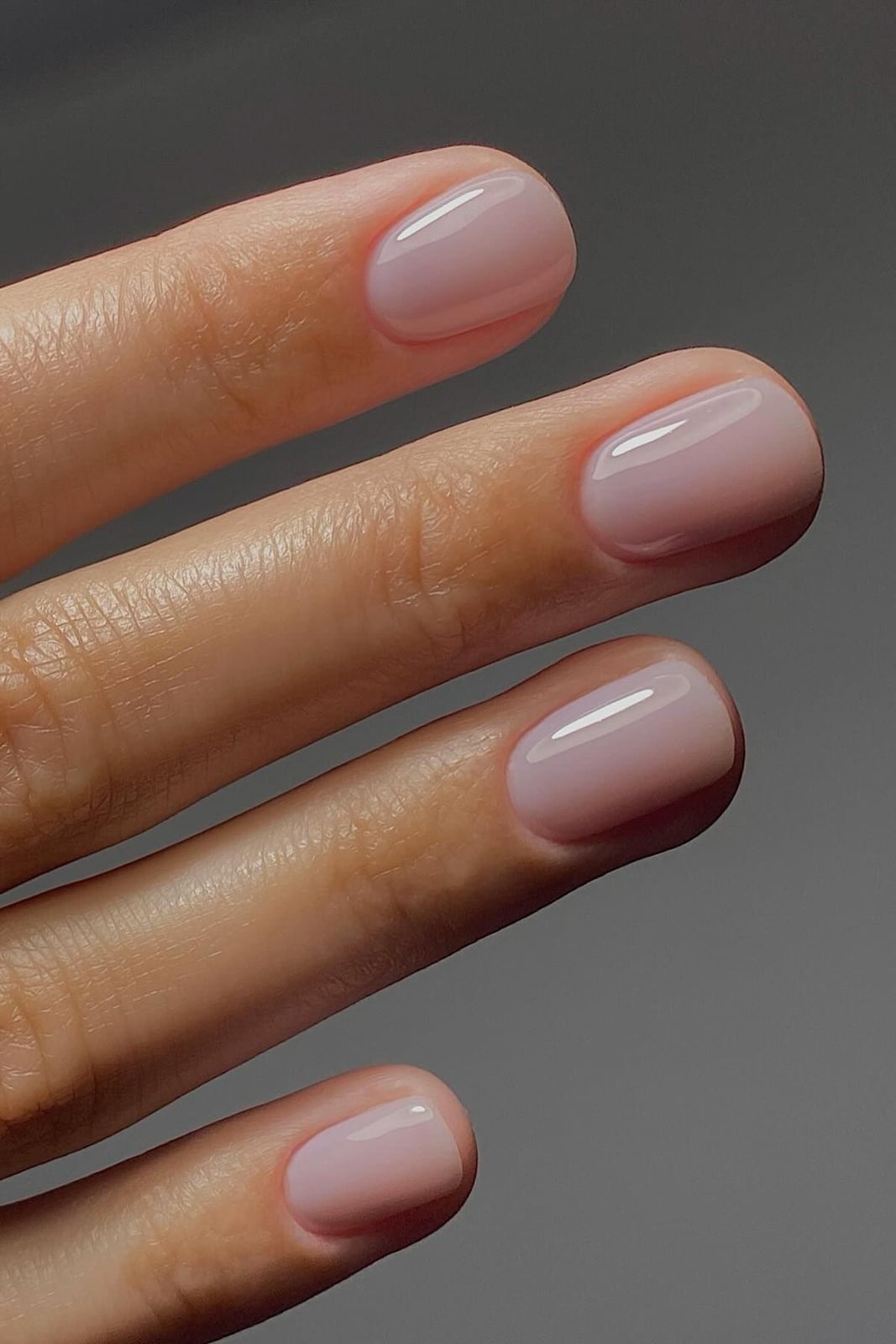 Short Oval Sheer Milky Pink Glossy Nails, Close-Up Take Short Oval Sheer Milky Pink Glossy Nails, Close-Up Take — Trendy Manicure Nails
