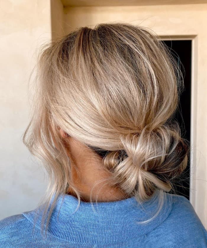 Ash Blonde Low Messy Bun With Darker Roots — Trendy Messy Bun Updo