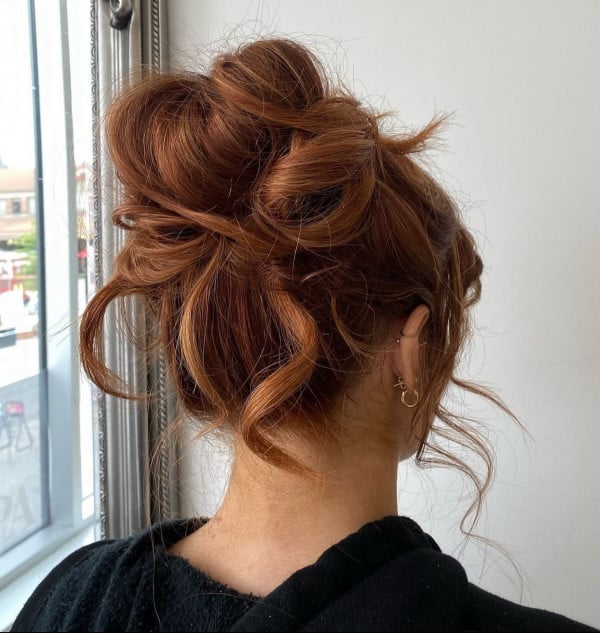 Fiery Red Messy Bun With Loose Strands — Trendy Messy Bun Updo