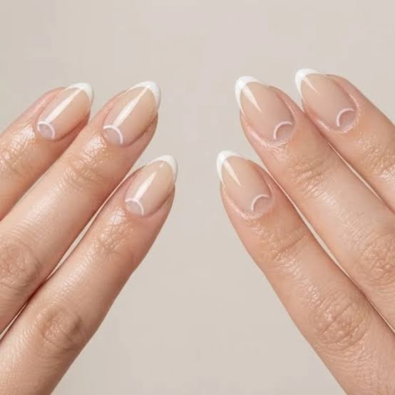 Short Almond Nude With Half Moon French Tips Short Almond Nude With Half Moon French Tips — Trendy Minimal Nails