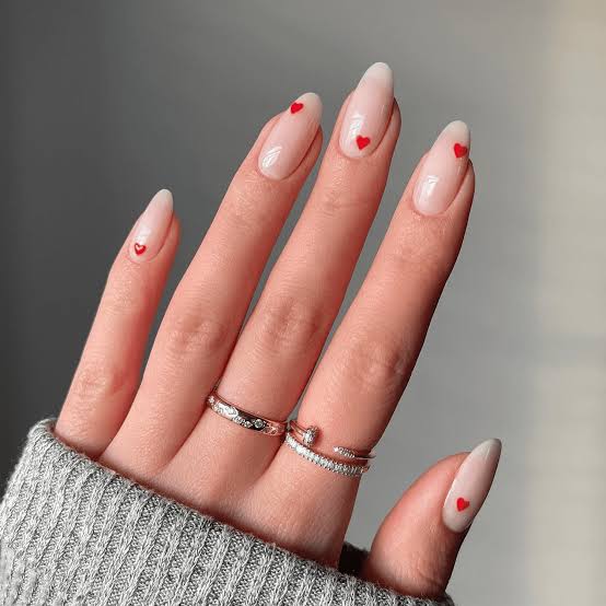 Short Almond Sheer Nude With Red Hearts Short Almond Sheer Nude With Red Hearts — Trendy Minimal Nails