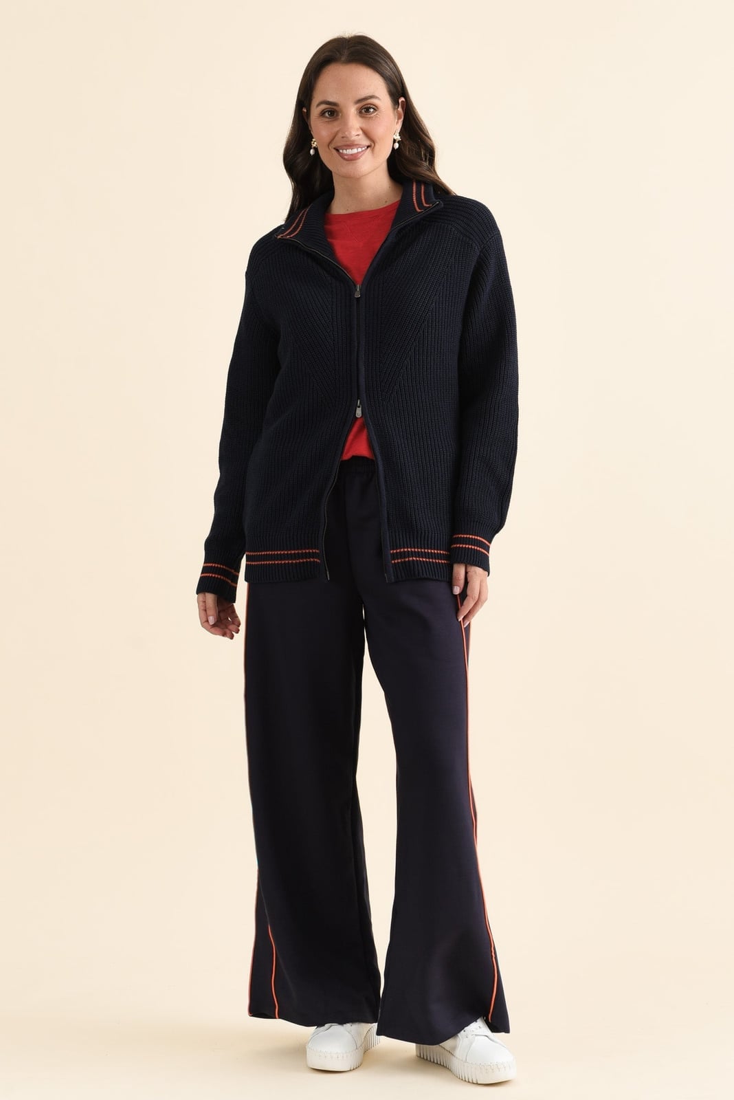 Navy Zip-Up Sweater With Orange Trim And Trousers — Trendy Navy Blue Outfits