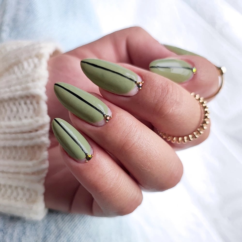 Olive Green Minimalist Black Line Art Medium Almond Nails Olive Green Minimalist Black Line Art Medium Almond Nails — Trendy Olive Green Nails