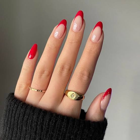 Sheer Nude Medium Almond with Red French Tips — Trendy Red Almond Nails