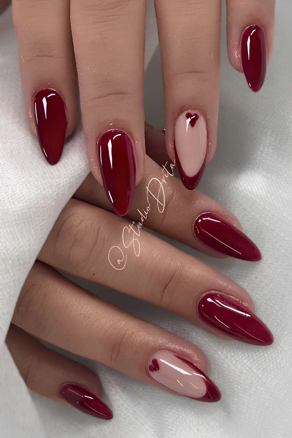 Nude Base Medium Almond with Red French and Heart, Close-Up Take — Trendy Red Almond Nails