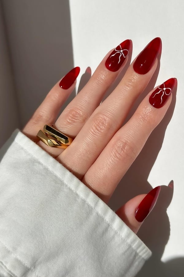 Translucent Deep Red Almond with White Bows — Trendy Red Almond Nails