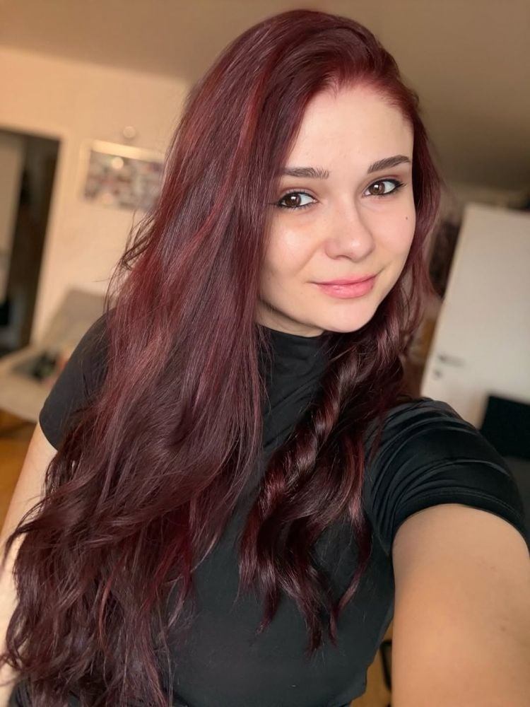 Mid-Back Vibrant Red With Curtain Bangs Mid-Back Vibrant Red With Curtain Bangs — Trendy Red Hairstyles