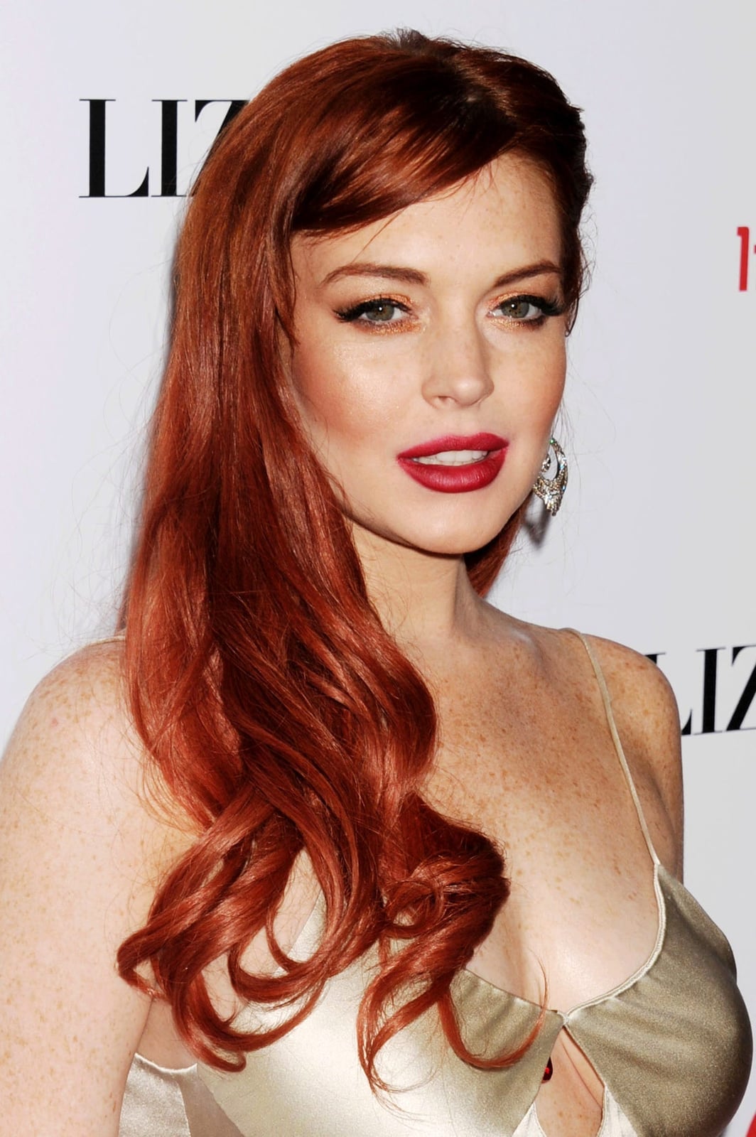 Mid-Back Vibrant Red Loose Voluminous Curls Mid-Back Vibrant Red Loose Voluminous Curls — Trendy Red Hairstyles