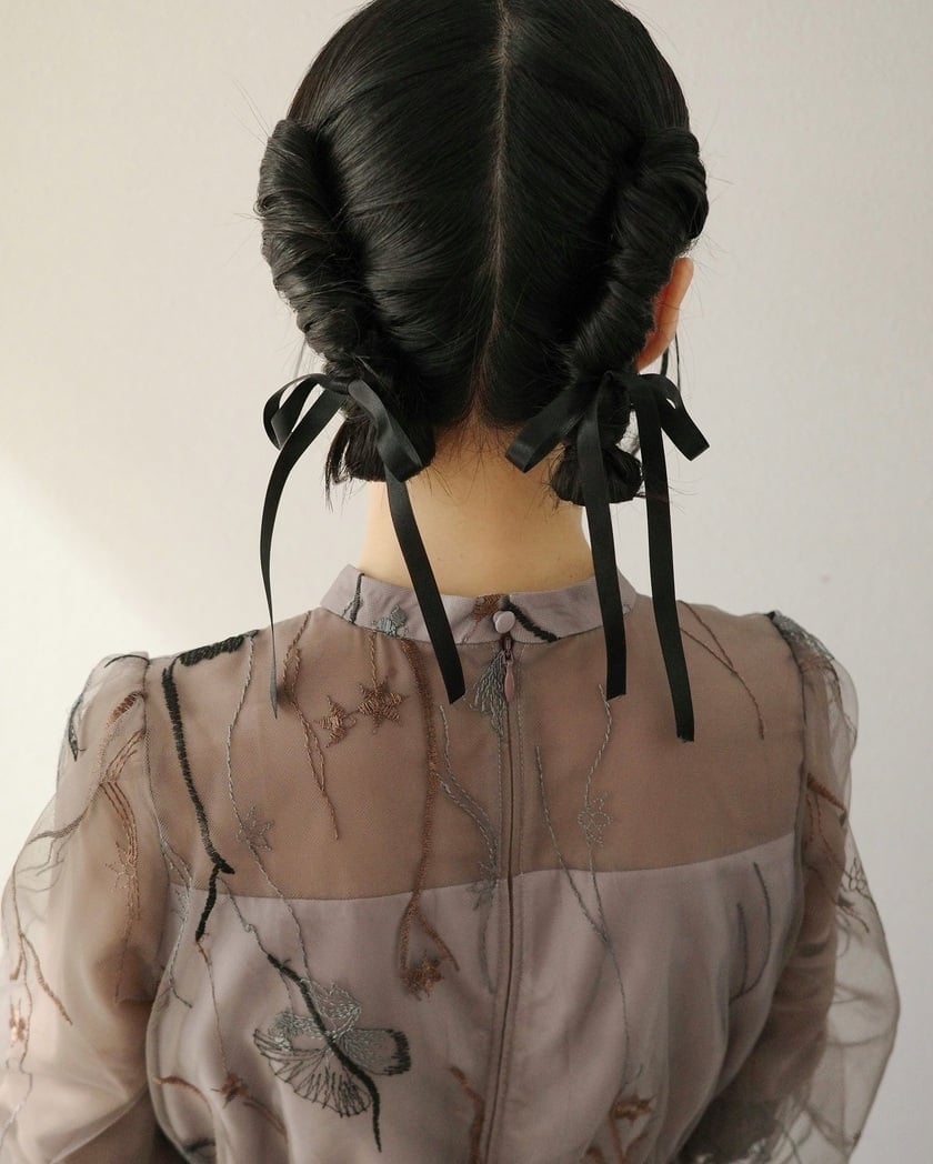 Dark Twisted Buns With Black Ribbons Dark Twisted Buns With Black Ribbons — Trendy Ribbon Braids