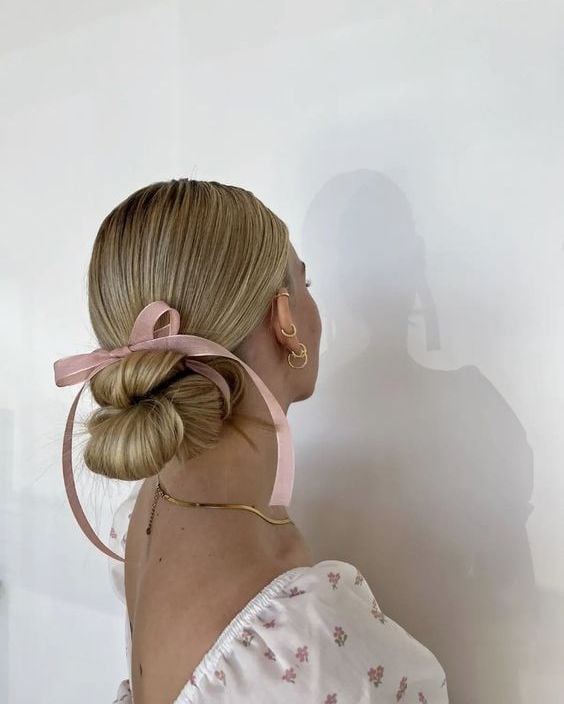 Shoulder Length Blonde Bun With Pink Ribbon — Trendy Ribbon Hair