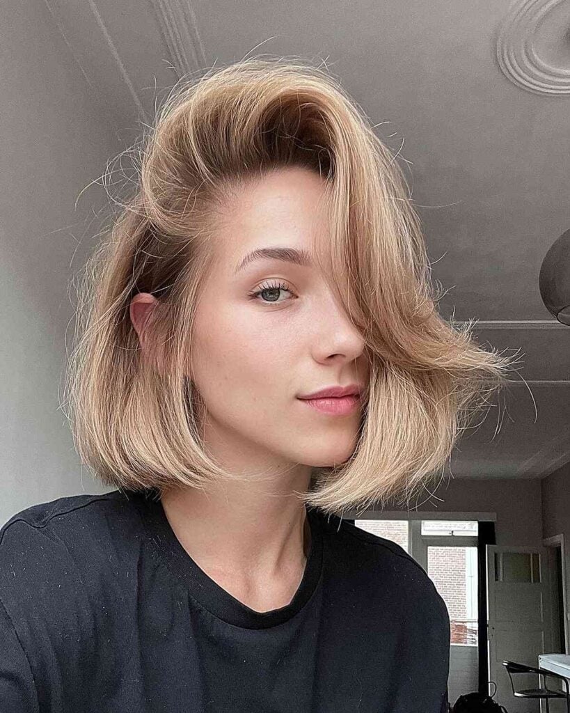 Honey Blonde Bob With Side Swept Bangs Honey Blonde Bob With Side Swept Bangs — Trendy Short Bob