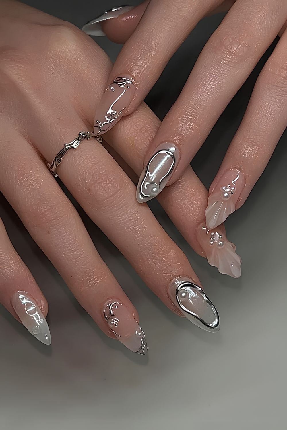 Long Almond Nails With Chrome Accents and Pearls Long Almond Nails With Chrome Accents and Pearls — Trendy Silver Chrome Nails