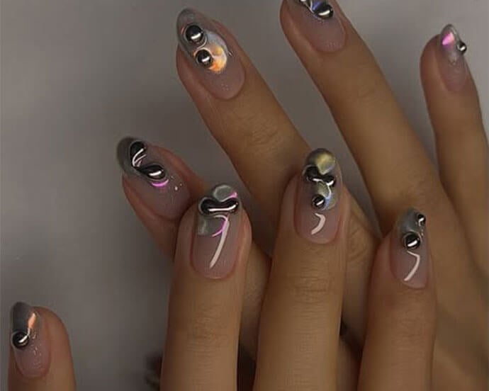Medium Almond Nails With 3D Silver Chrome Accents Medium Almond Nails With 3D Silver Chrome Accents — Trendy Silver Chrome Nails