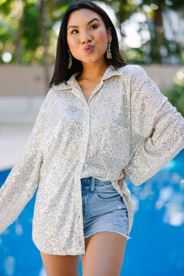 Oversized Silver Sequin Shirt with Denim Shorts, Close-Up Take — Trendy Silver Outfits