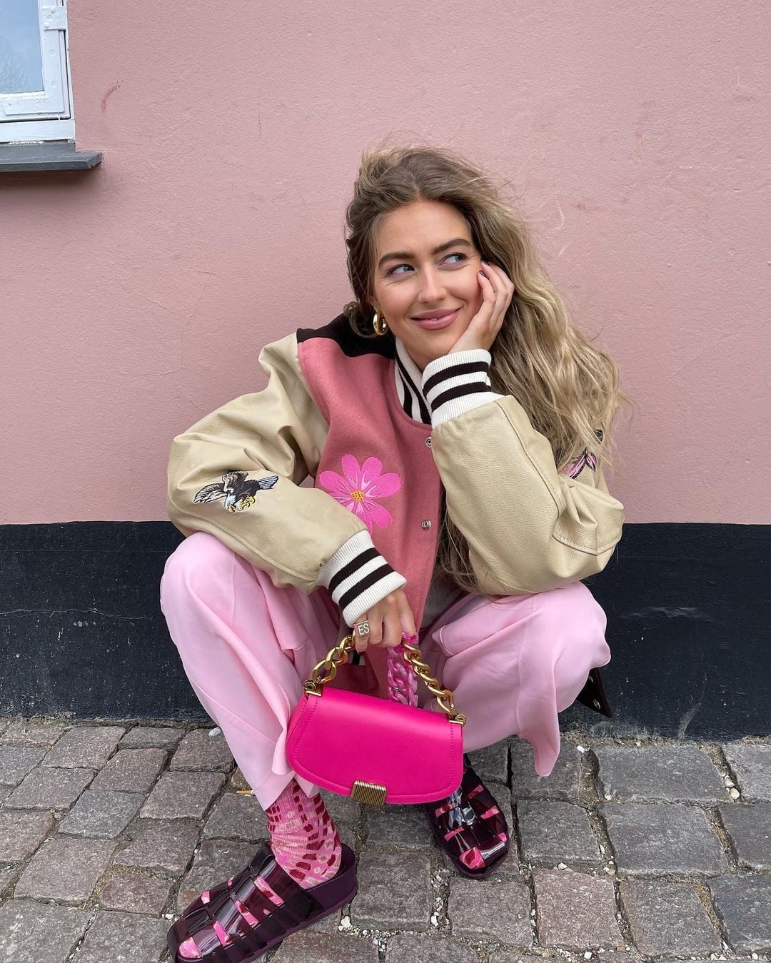 Pink Patterned Socks with Slides and Varsity Jacket — Trendy Socks Outfits