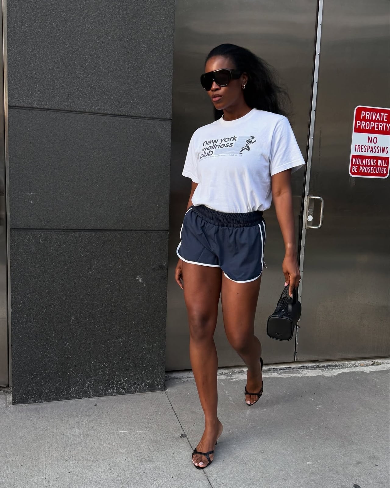 Graphic T-Shirt With Athletic Shorts and Heeled Sandals, Close-Up Take — Trendy Sporty Outfits