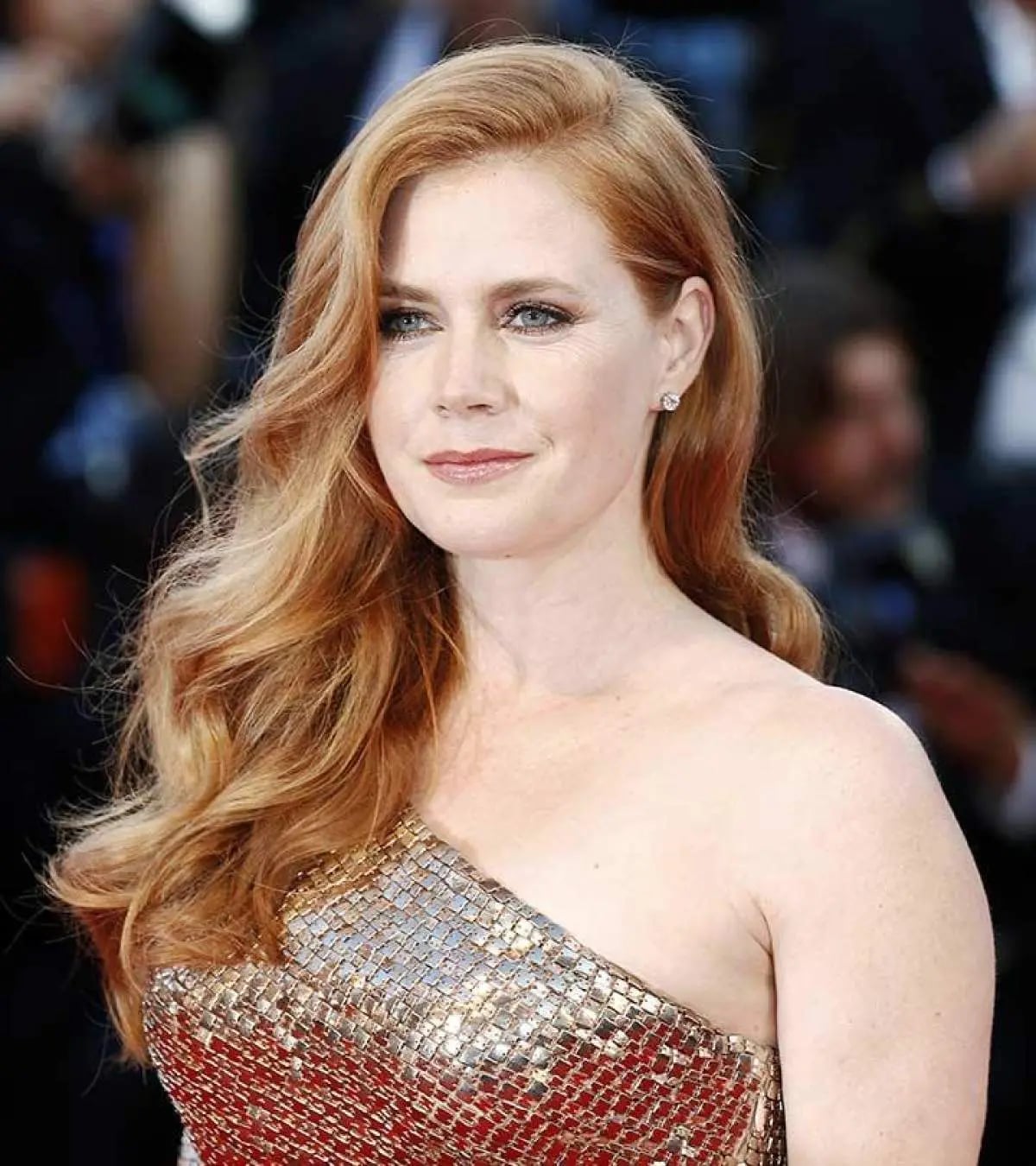 Dimensional Strawberry Blonde Voluminous Curls — Trendy Strawberry Blonde Hair