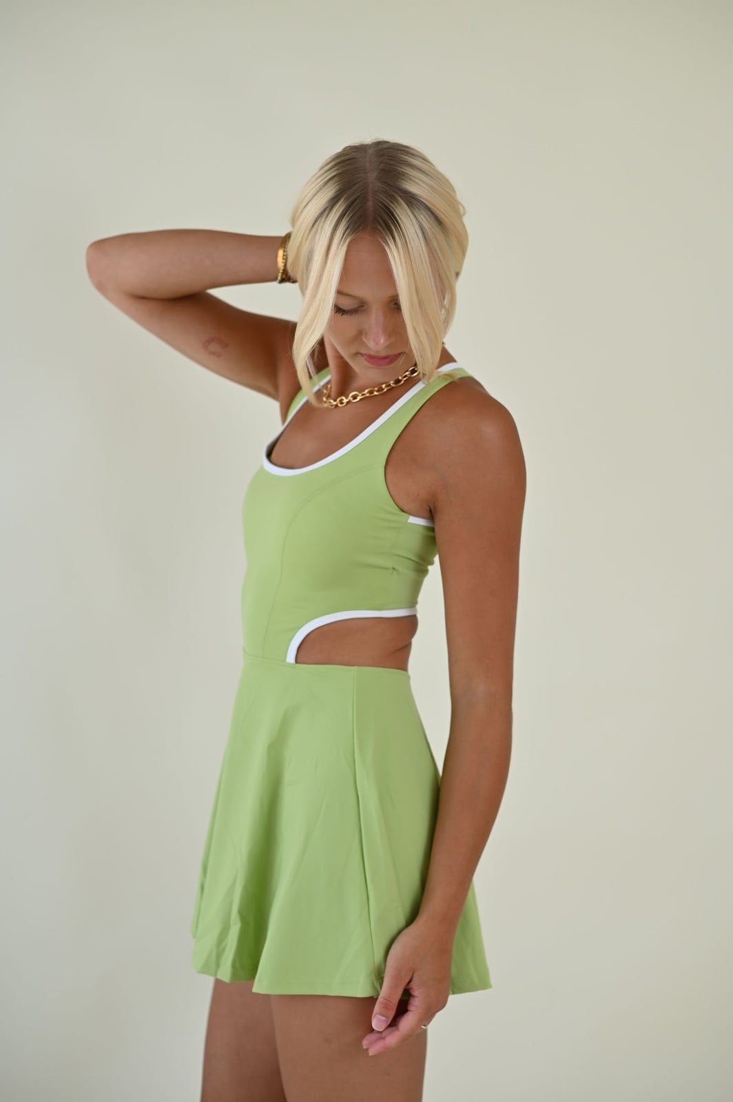 Lime Green Tennis Dress with Side Cut-Outs, Close-Up Take Lime Green Tennis Dress with Side Cut-Outs, Close-Up Take — Trendy Tennis Outfits