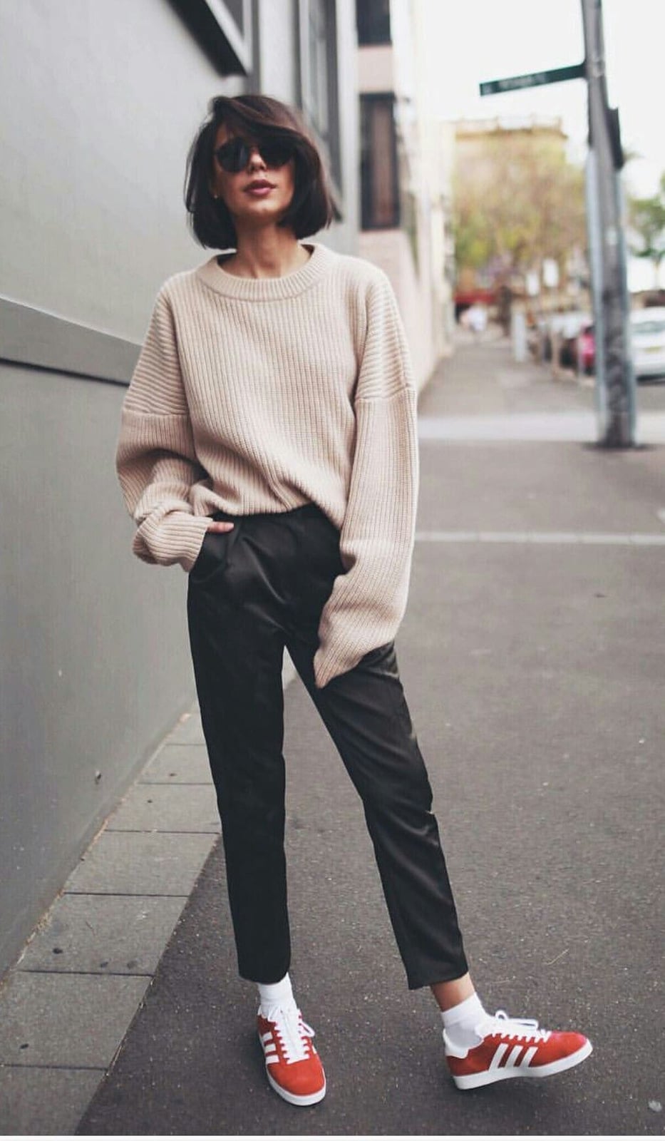 Beige Knit Sweater with Black Trousers and Red Sneakers Beige Knit Sweater with Black Trousers and Red Sneakers — Trendy Tomboy Outfits