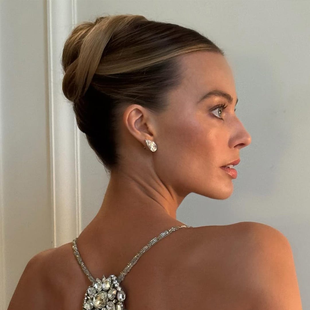 Sleek Dark Blonde Chignon — Trendy Wedding Guest Updos