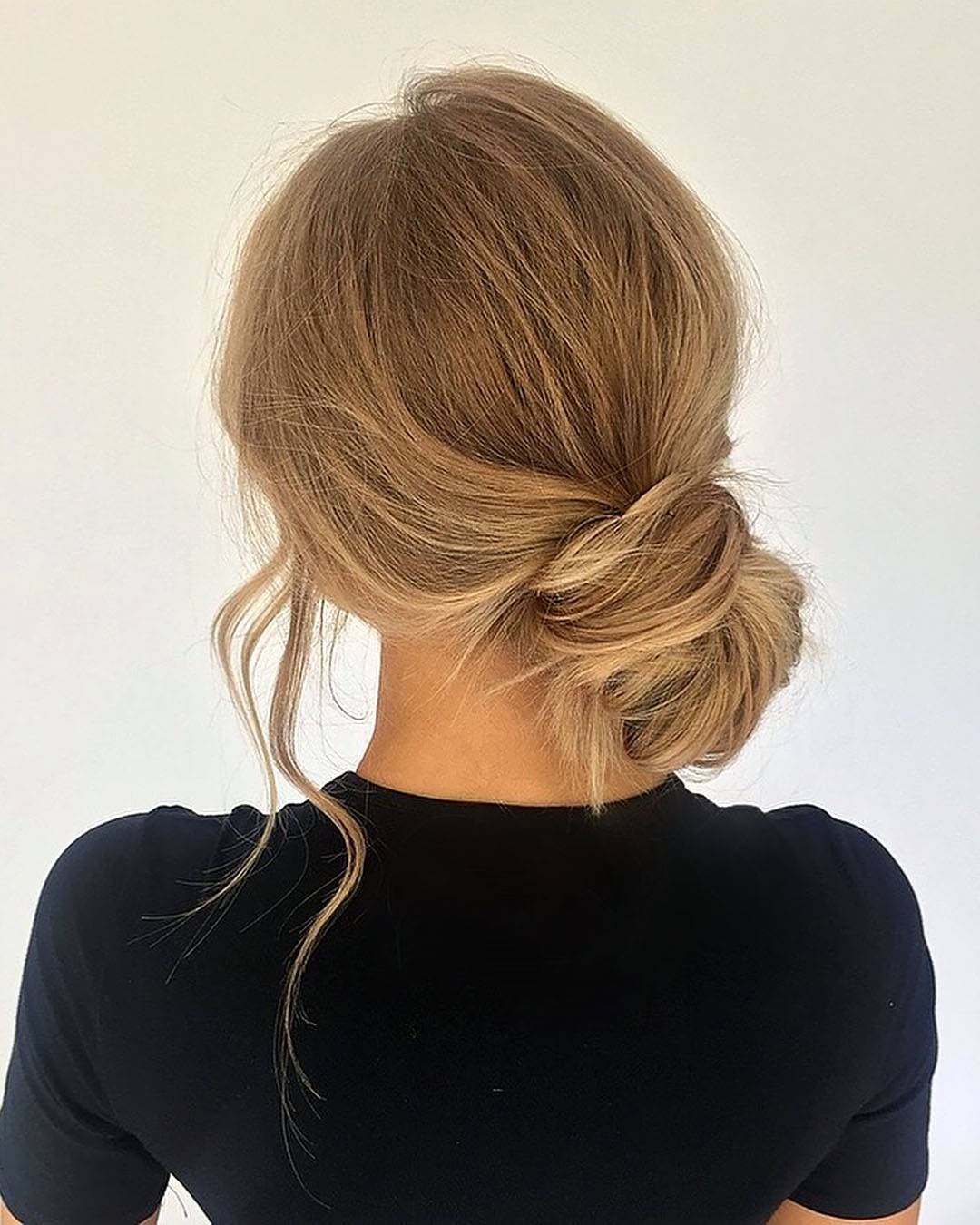 Light Brown Loose Low Bun — Trendy Wedding Guest Updos