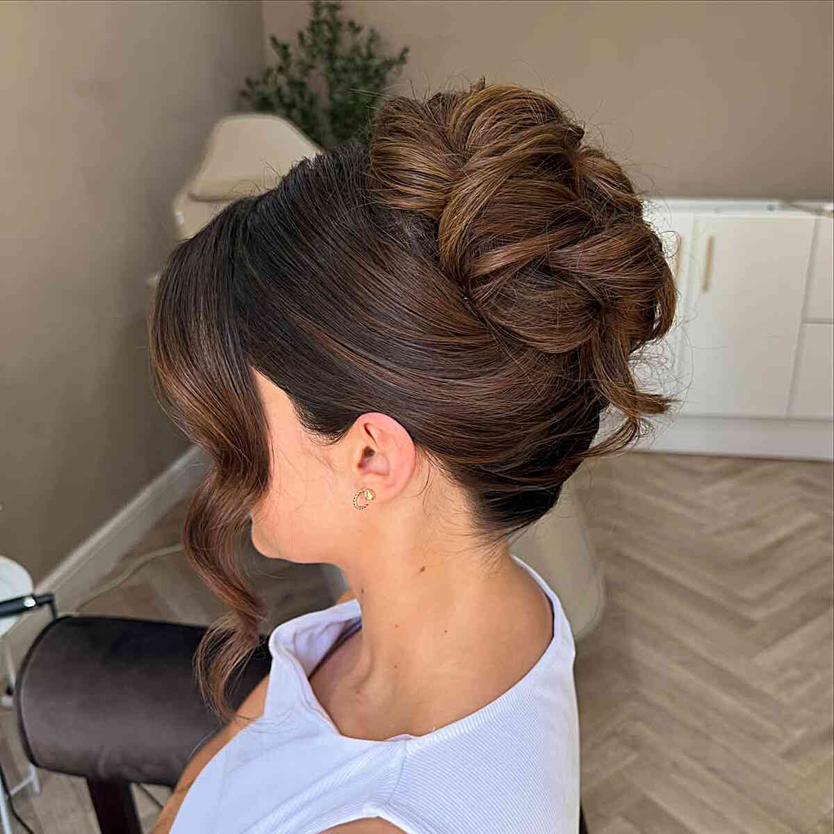 Dark Brown High Bun With Volume — Trendy Wedding Guest Updos