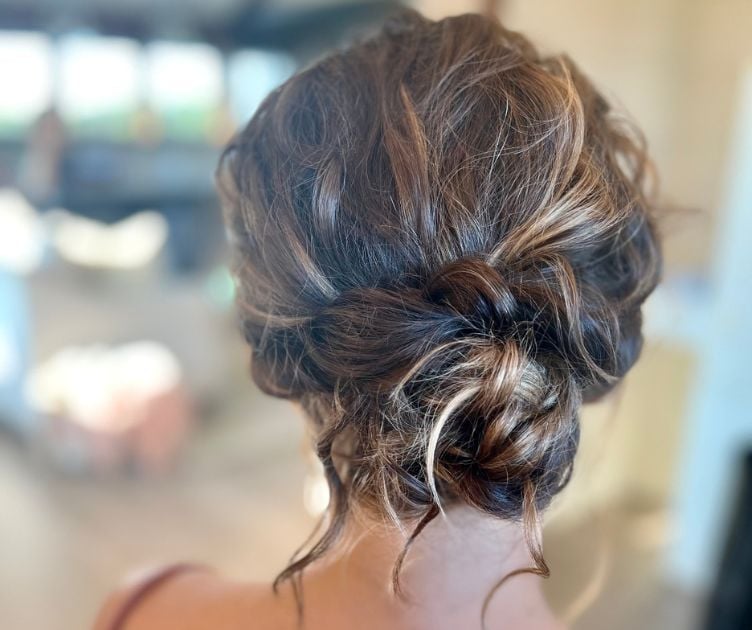 Brunette Messy Bun With Blonde Highlights — Trendy Wedding Guest Updos