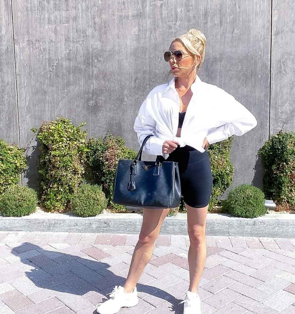 Oversized White Shirt and Black Biker Shorts with White Sneakers Oversized White Shirt and Black Biker Shorts with White Sneakers — Trendy White Sneakers Outfits