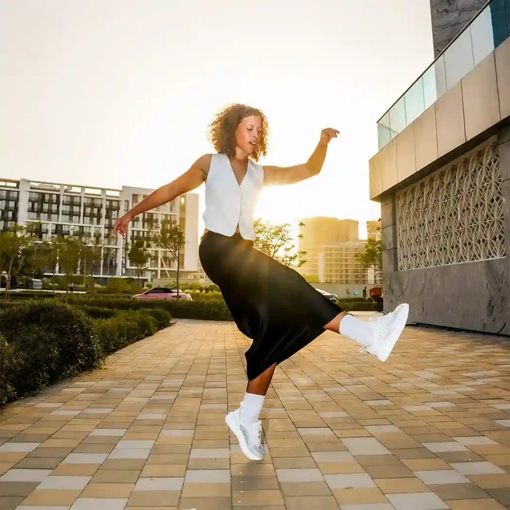 White Vest and Black A-line Skirt with Sparkly White, Close-Up Take White Vest and Black A-line Skirt with Sparkly White, Close-Up Take — Trendy White Sneakers Outfits