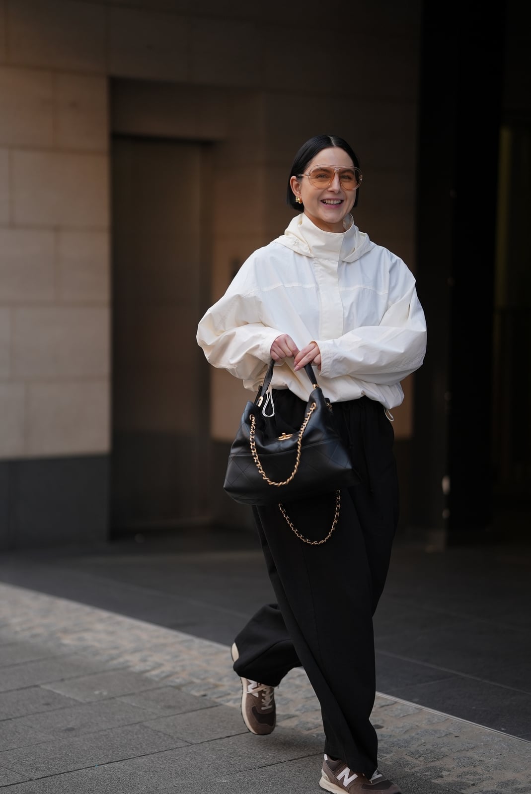 Oversized Cream Windbreaker with White Turtleneck, Close-Up Take — Trendy Windbreaker Outfits