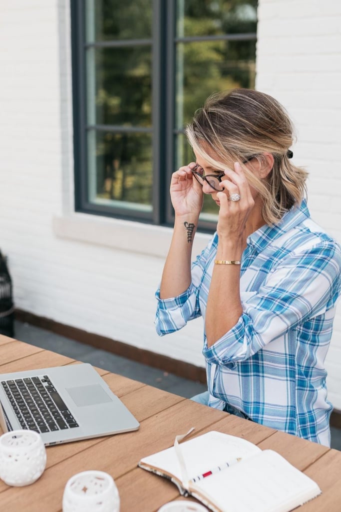 Plaid Shirt Over T-Shirt for Home Office With Adjusting Her Glasses Plaid Shirt Over T-Shirt for Home Office With Adjusting Her Glasses — Trendy Work From Home Outfits