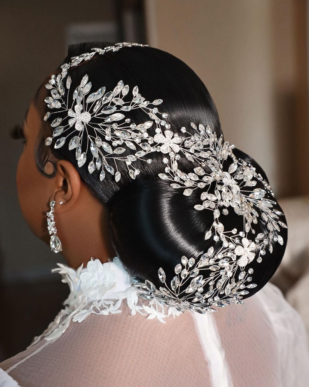Polished Sculpted Black Updo With Crystals Polished Sculpted Black Updo With Crystals — Wedding Bun Ideas