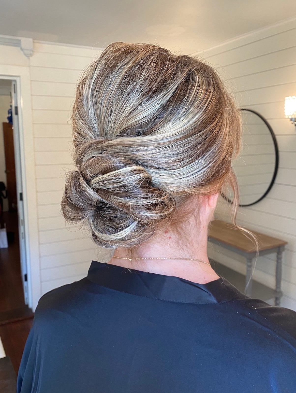 Low Bun With Twisted Blonde Sections Low Bun With Twisted Blonde Sections — Wedding Bun Ideas